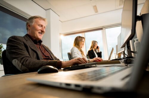 People in front of their laptops working