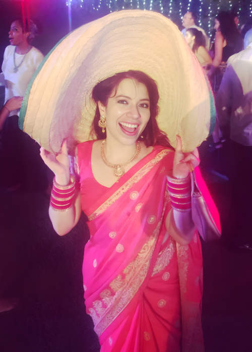 ACCESS Stories March 2026. Finding Myself Through Cultures. Sarai in a pink sari and a Mexican hat at a party.