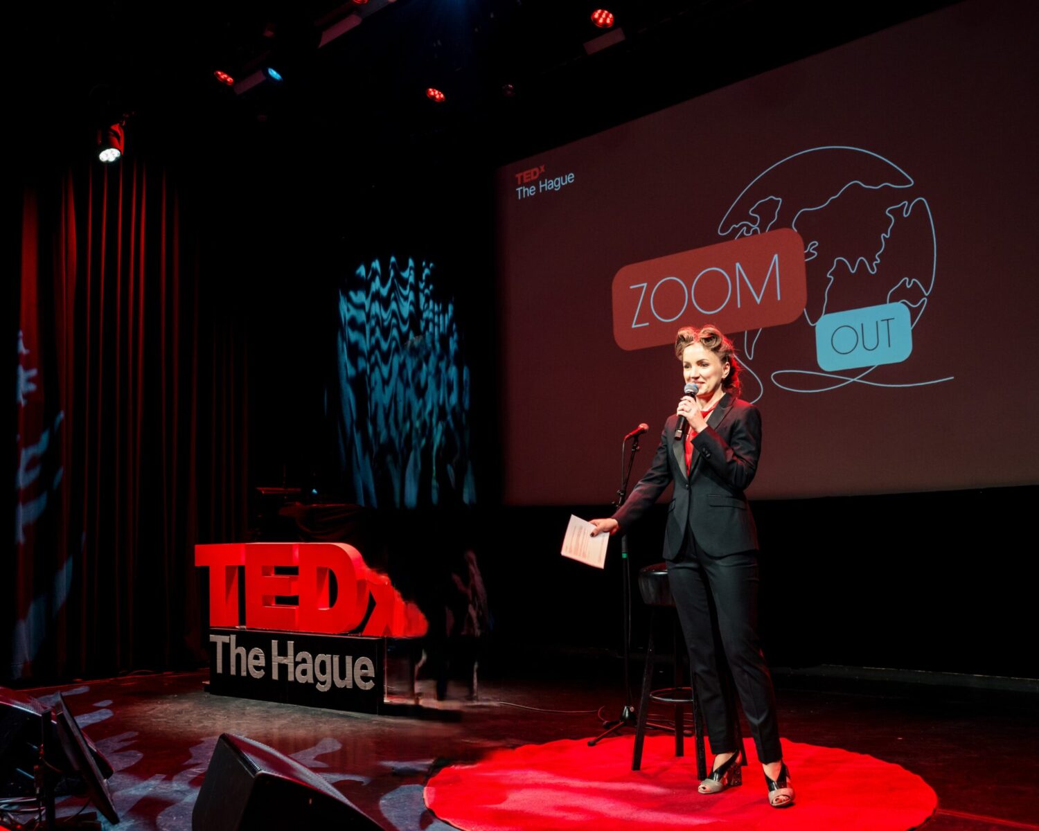 ACCESS Stories June 2026. Reinventing Yourself Abroad. Ana Denis giving a speech at TEDx The Hague